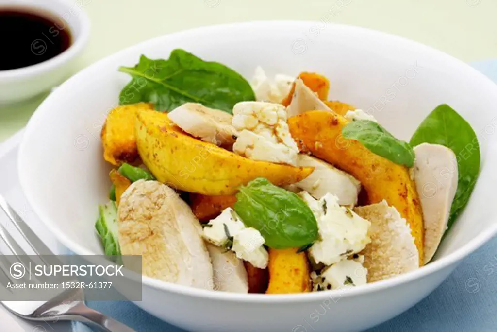 Fried butternut squash, poached chicken, spinach and feta salad