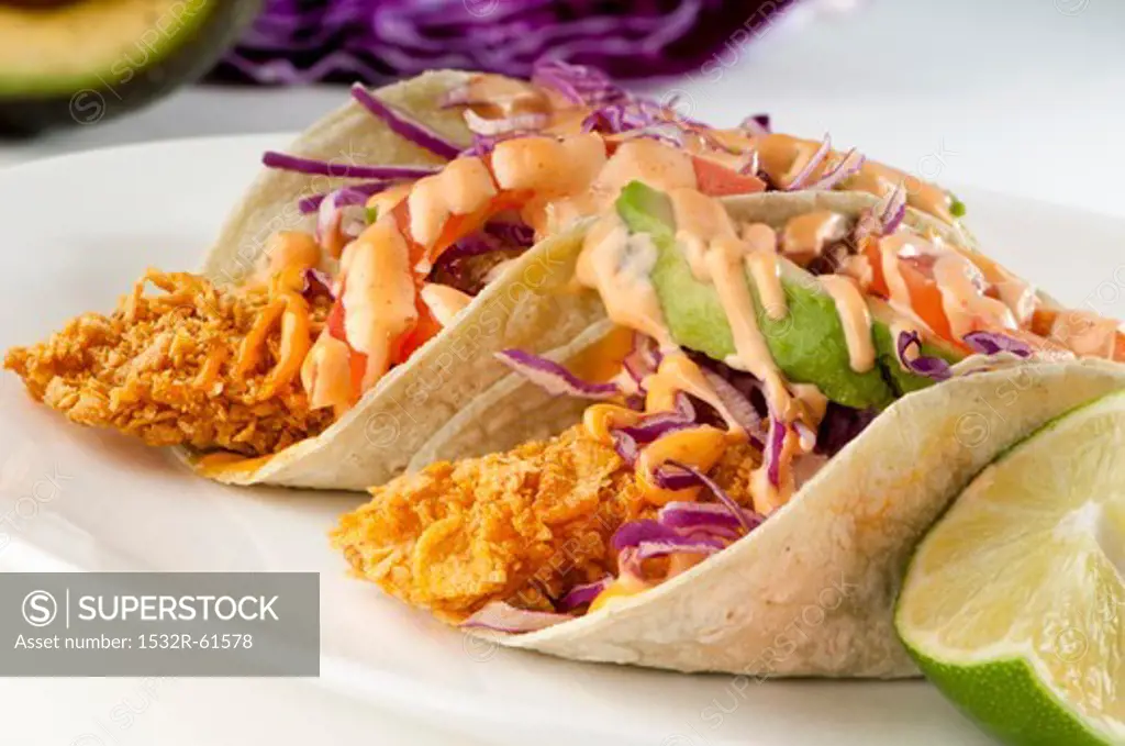 Fried Tilapia Tacos with Slaw, Avocado and Spicy Mayo Sauce
