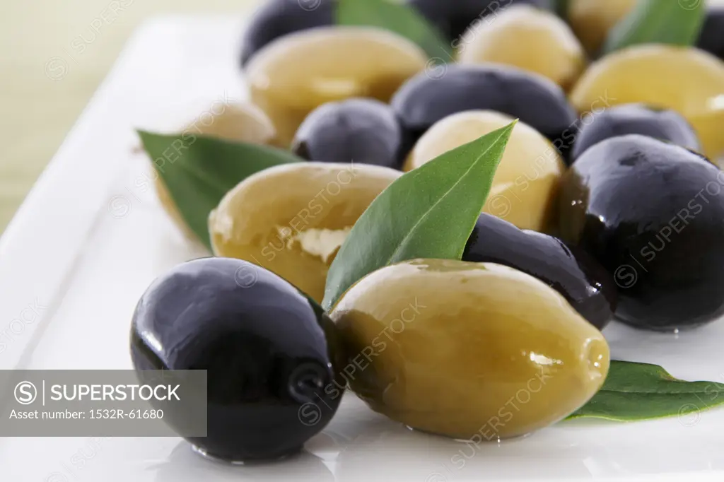 Green and Black Olives with Leaves