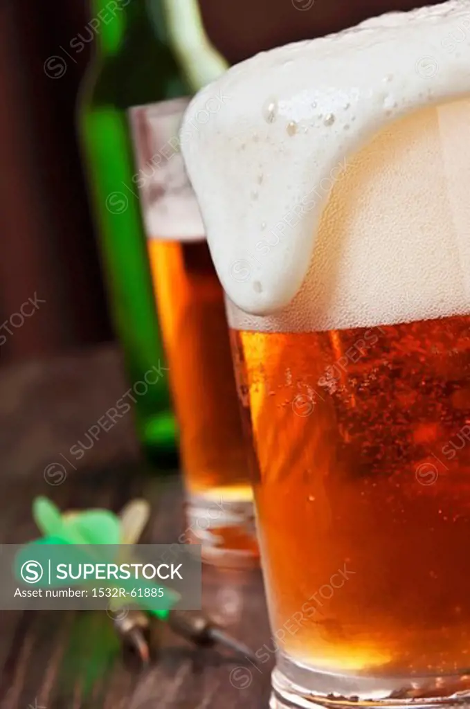 Foam Spilling Over the Top of a Glass of Beer