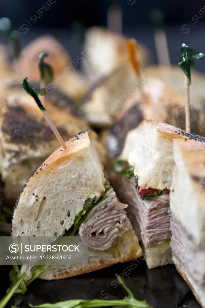 Roasted Pork Shoulder Sandwiches with Arugula, Hot Peppers and Garlic Aioli on a Platter
