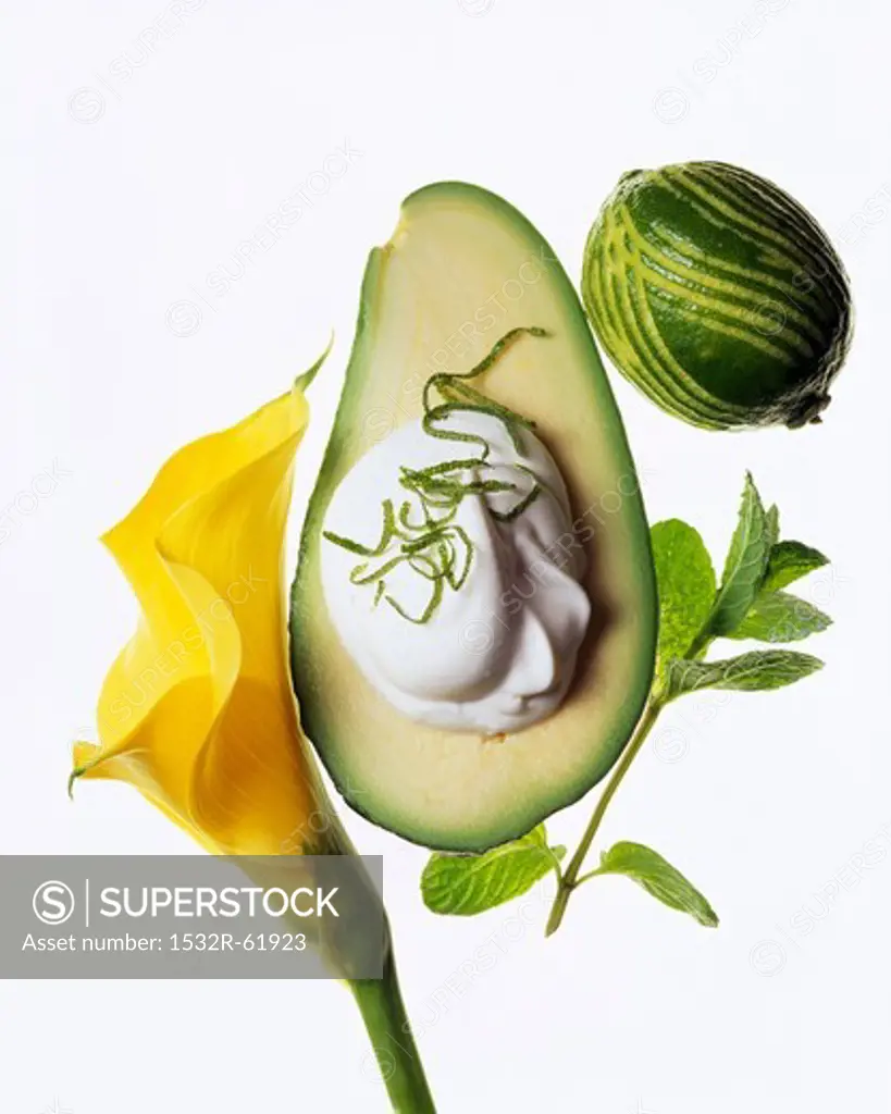 An avocado with sour cream and lime zest