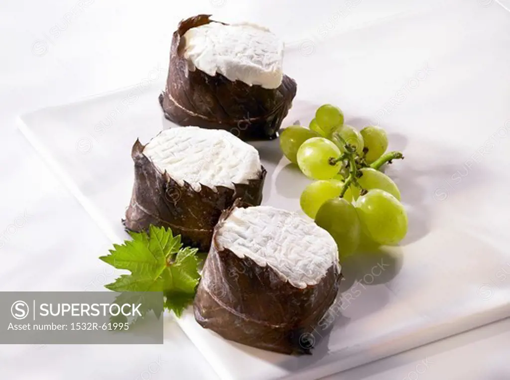Chabisfeuille (goat's cream cheese wrapped in chestnut leaves) and grapes