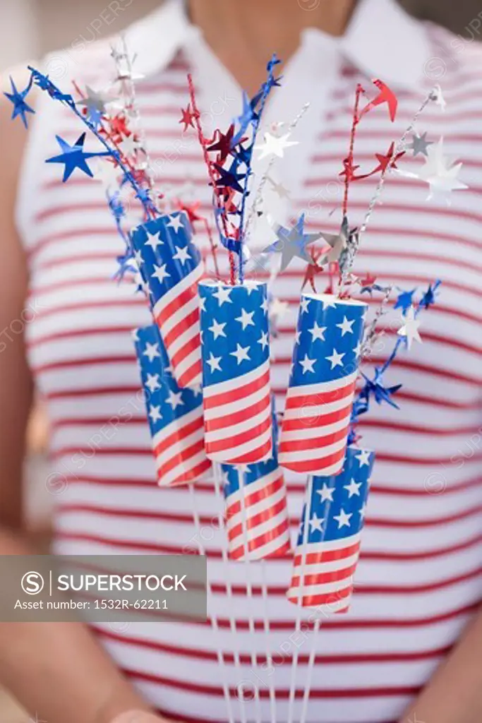 Woman holding sparklers (4th of July, USA)