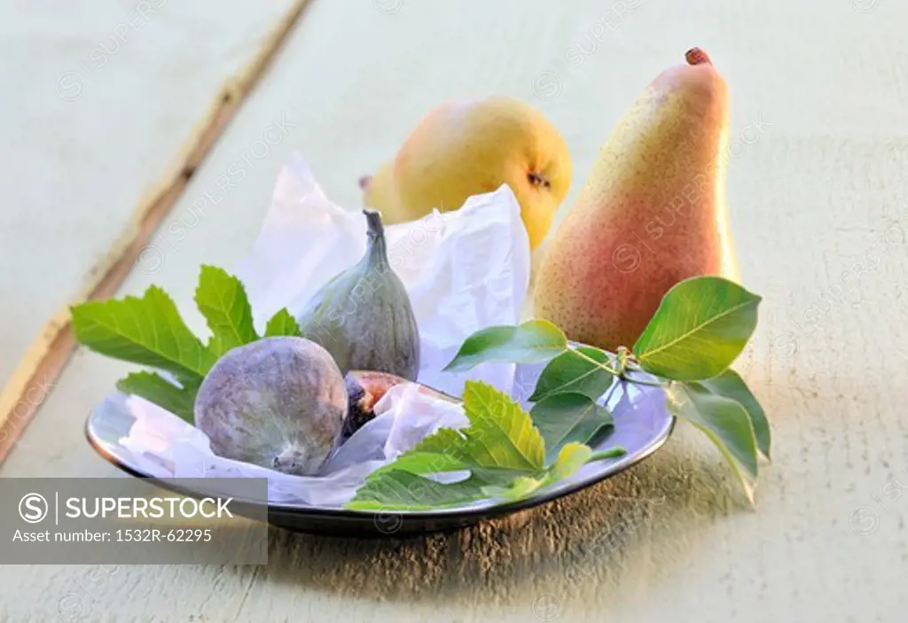 An arrangement of pears and figs