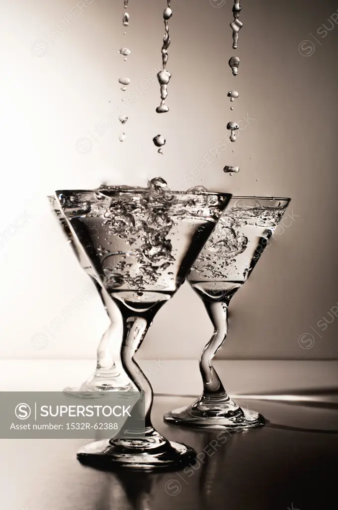 Martinis Dripping and Splashing into Glasses