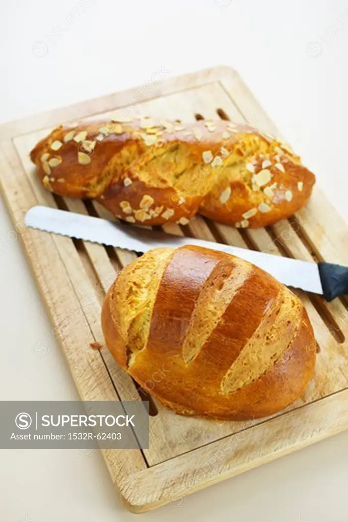 Two types of brioche on a wooden board
