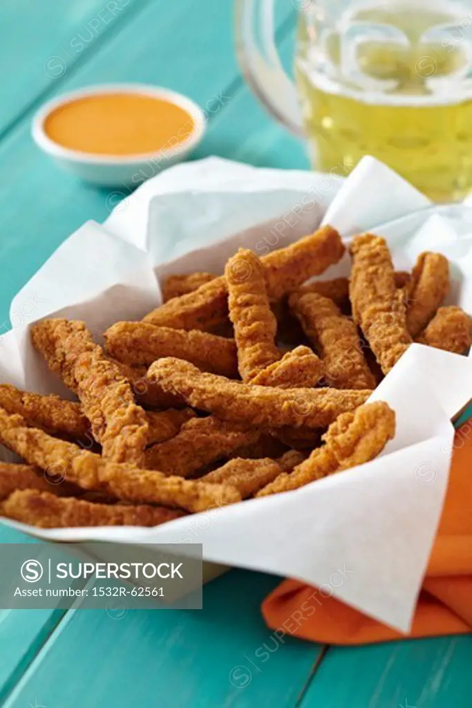 Basket of Chicken Fries with a Mug of Beer