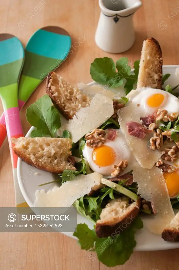 Salad with Arugula, Prosciutto, Fried Egg, Walnuts, Parmesan and Cheese Toasts