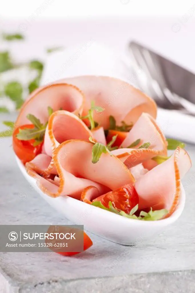 Ham with rocket and tomatoes