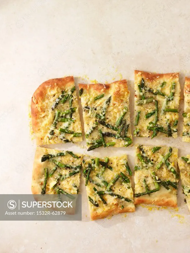 Asparagus pizza cut into slices