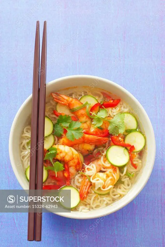 Spicy noodle soup with shrimps, chillis, courgette and coriander (Asia)