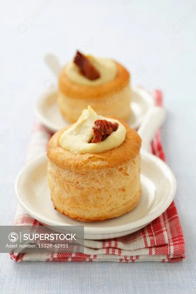 Vol au vents filled with hummus and dried tomatoes