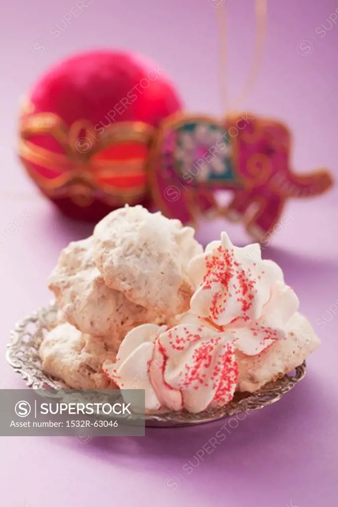 Macaroons and meringues on a silver plate