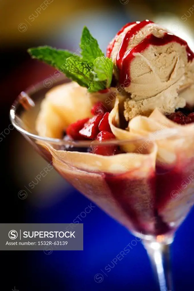 Ice Cream Sundae with Berry Sauce in a Stem Glass
