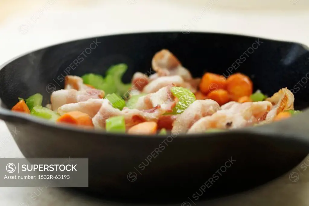 Bacon, Carrots and Celery in a Cast Iron Skillet