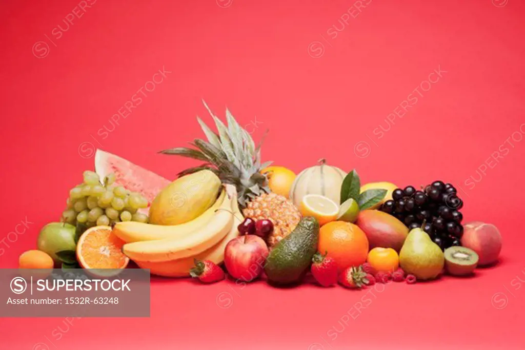 Various fruits on a red background