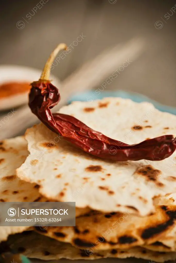 Dried Chili Pepper on a Stack of Crispy Tortillas