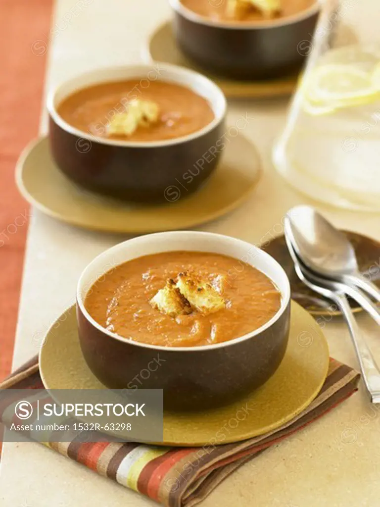 Bowls of Creamy Pumpkin Soup with Croutons
