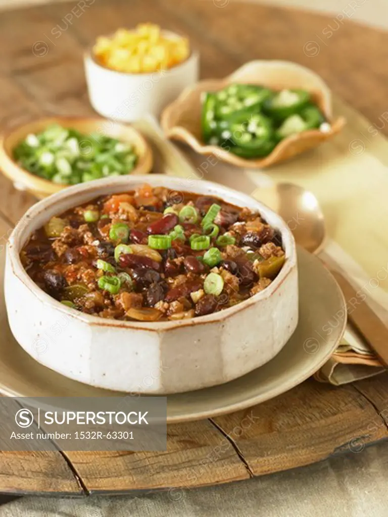 Bowl of Chili Con Carne with Assorted Toppings