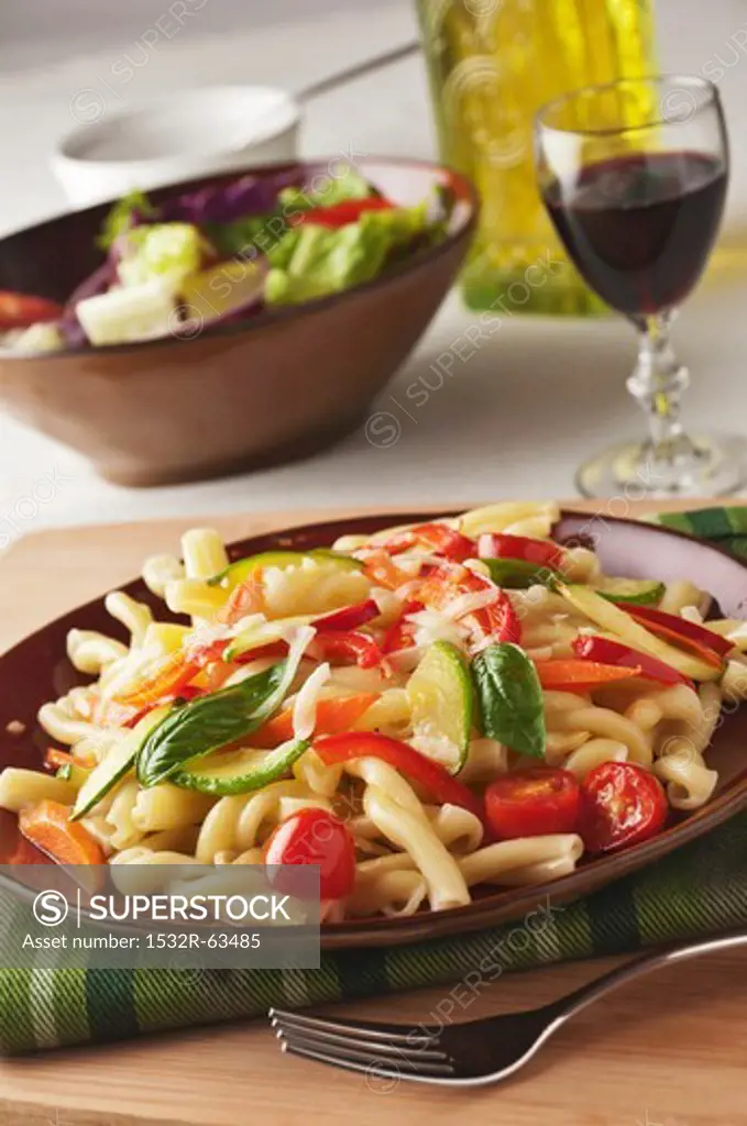 Pasta Primavera with Zucchini, Carrots, Red Pepper, Tomatoes, Basil and Grated Romano Cheese