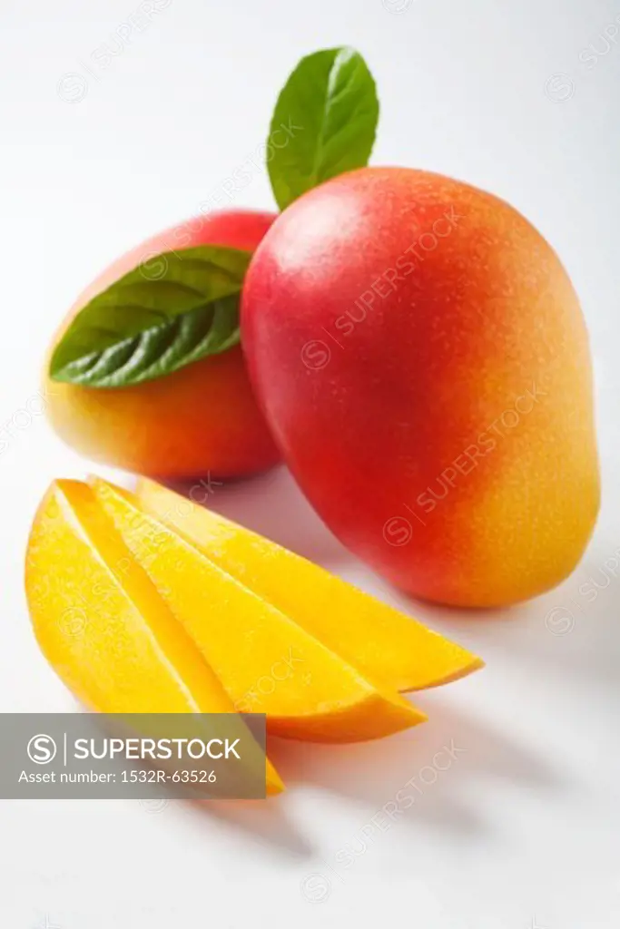 Mango slices and whole mangos