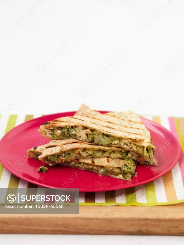 Quesadillas on a red plate