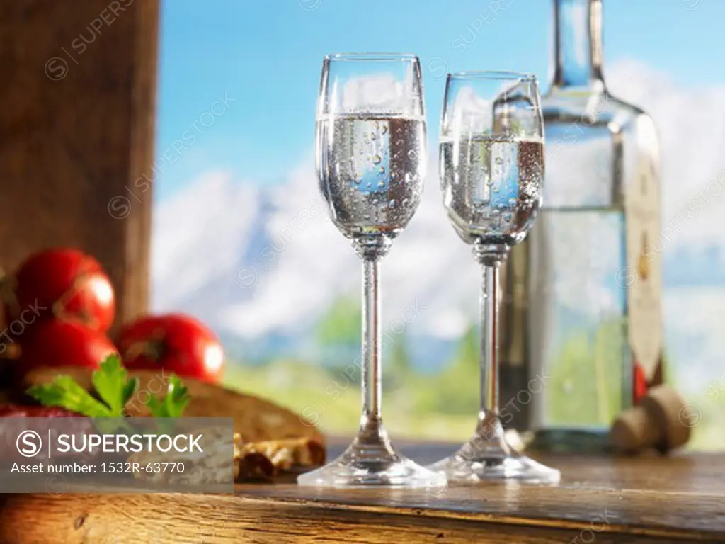 Two glasses of schnapps for supper against an alpine backdrop