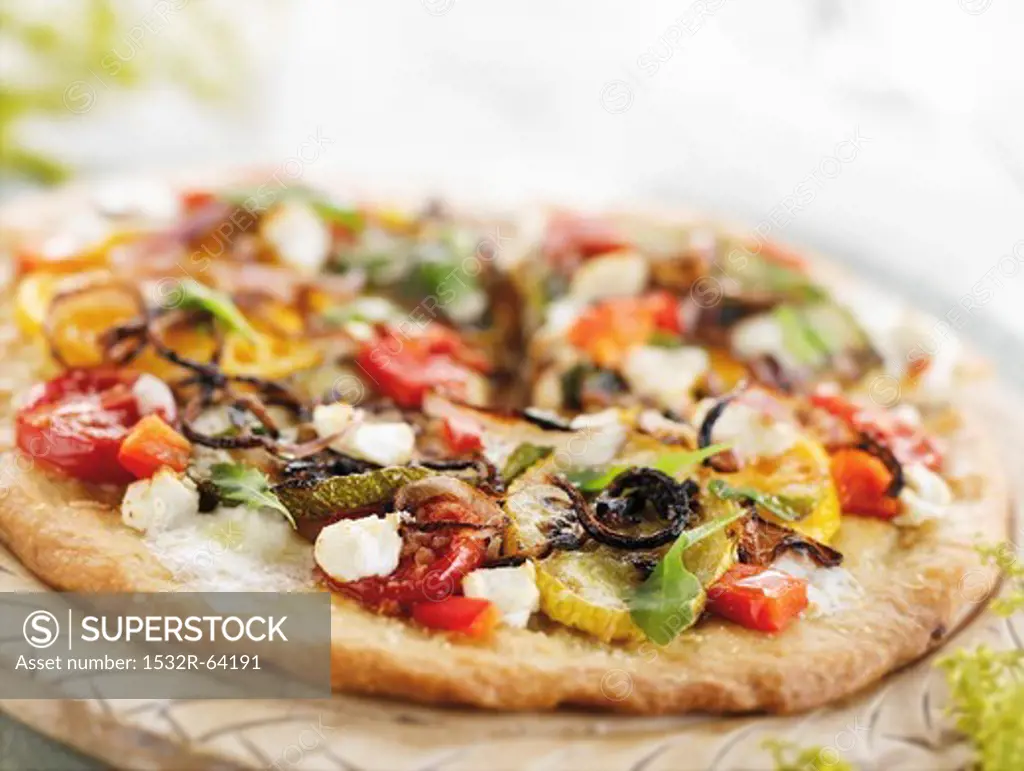 Vegetable Pizza on a Round Cutting Board