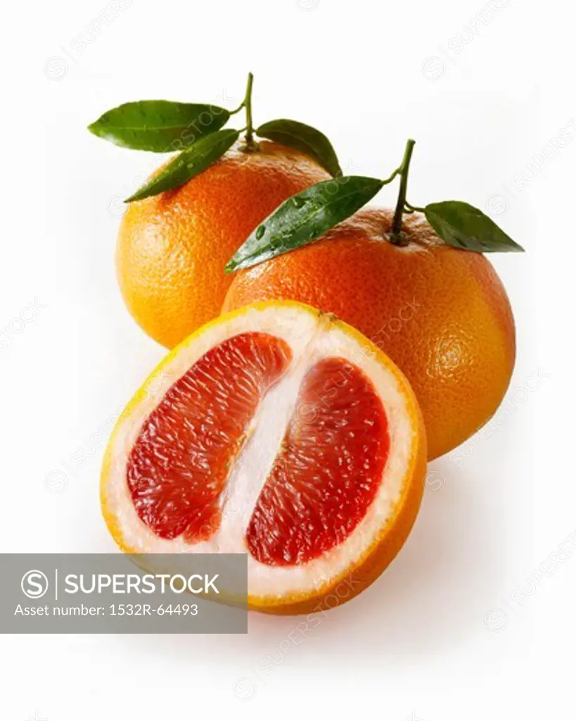 Red grapefruits, whole and halves