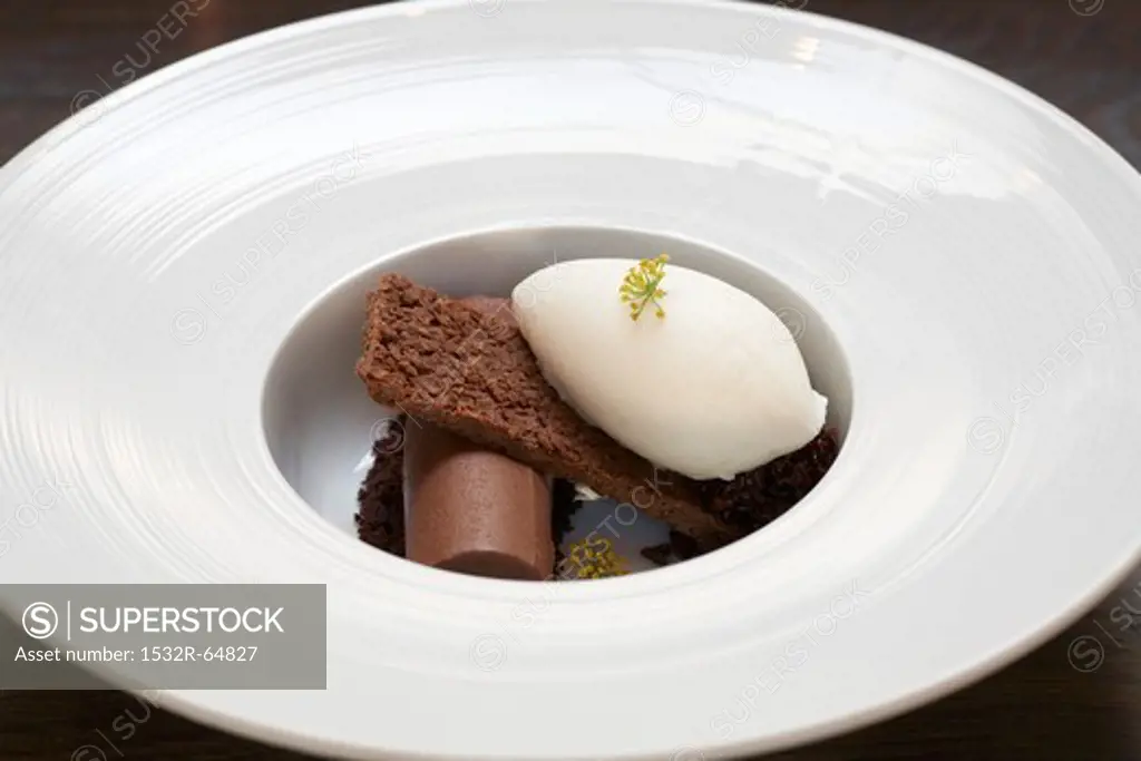 Chocolate Roll with Brownie and Vanilla Ice Cream in a White Bowl