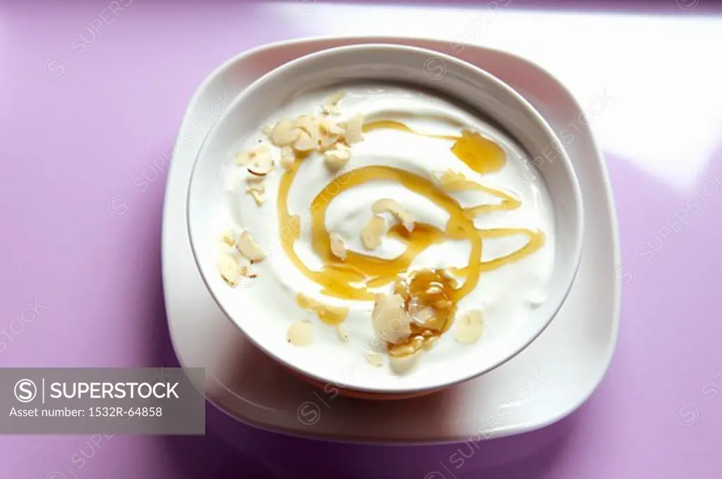 Yogurt with honey and grated hazelnuts