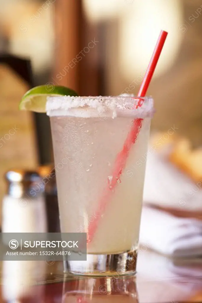 Margarita in a Glass with a Salted Rim and a Red Straw