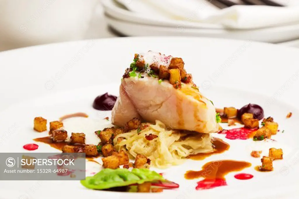 Catfish fillet with sauerkraut and beetroot essence