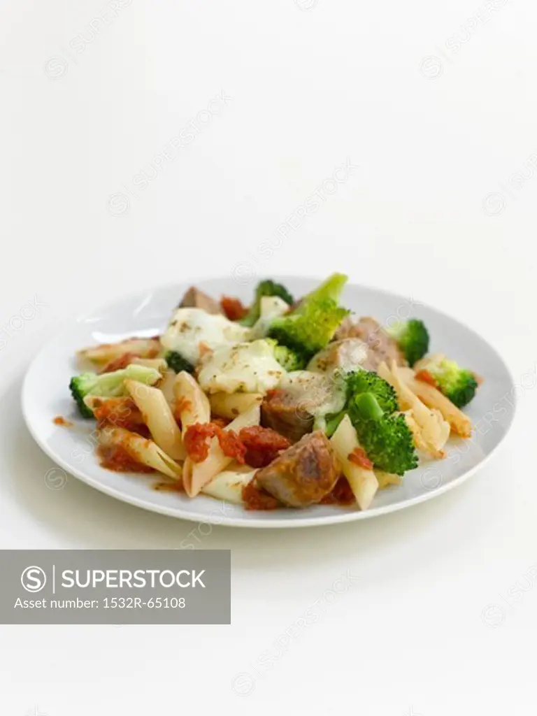 Penne pasta bake with sausages, broccoli and cheese