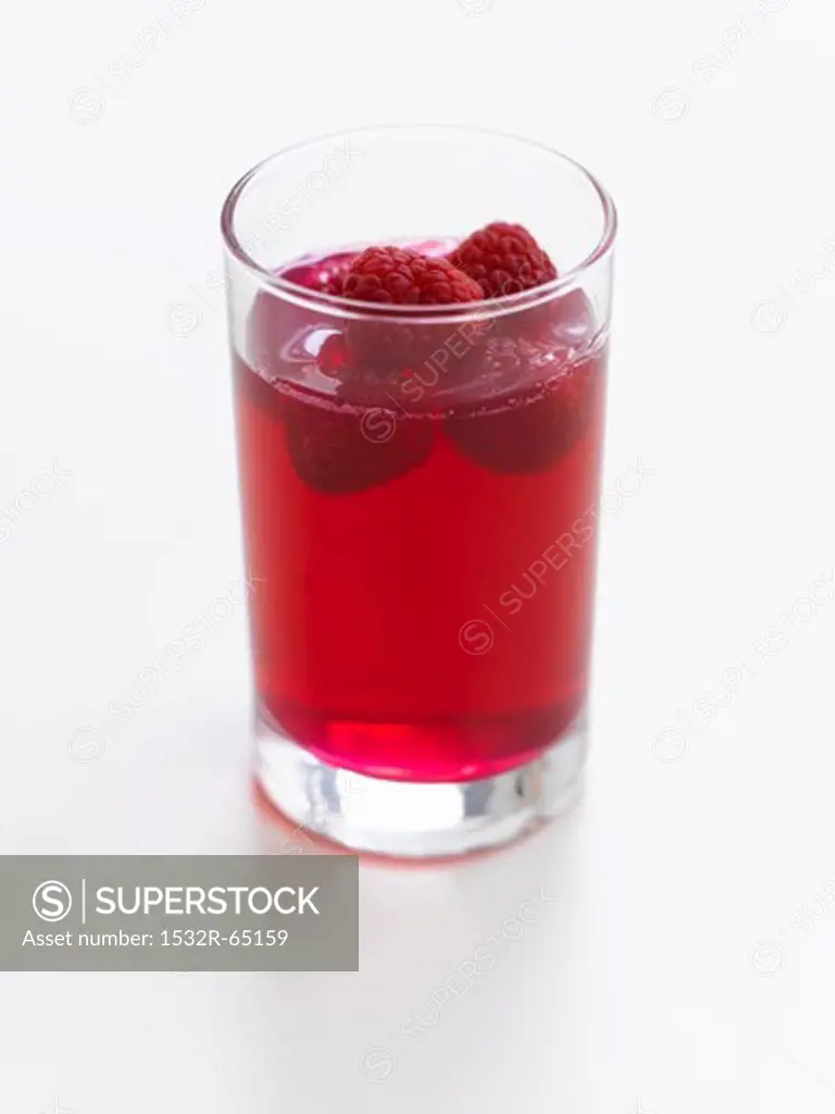 A glass of raspberry jelly