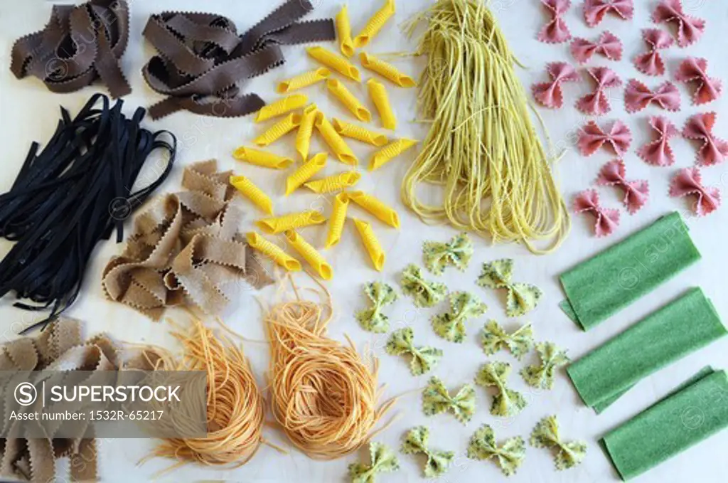 An arrangement of various colourful types of pasta