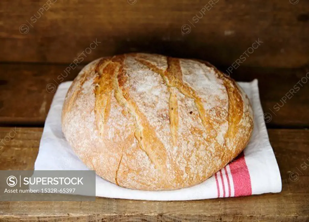 Boule (French white bread) on a tea towel