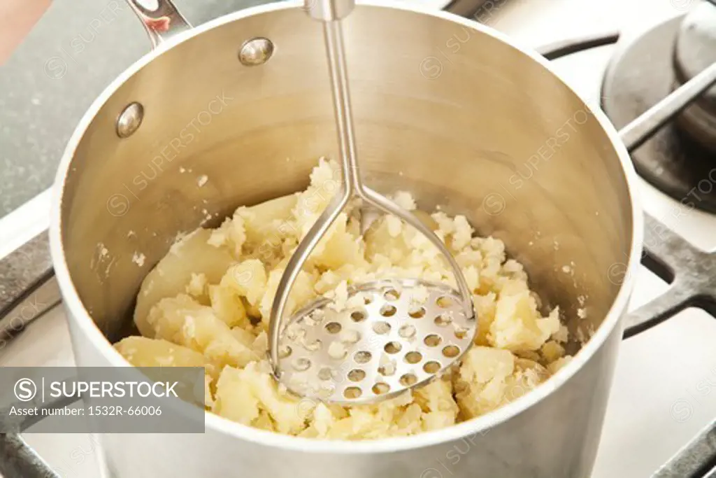Mashing Potatoes in a Pot