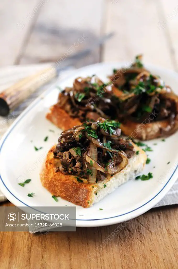 Crostini topped with chicken liver and onions