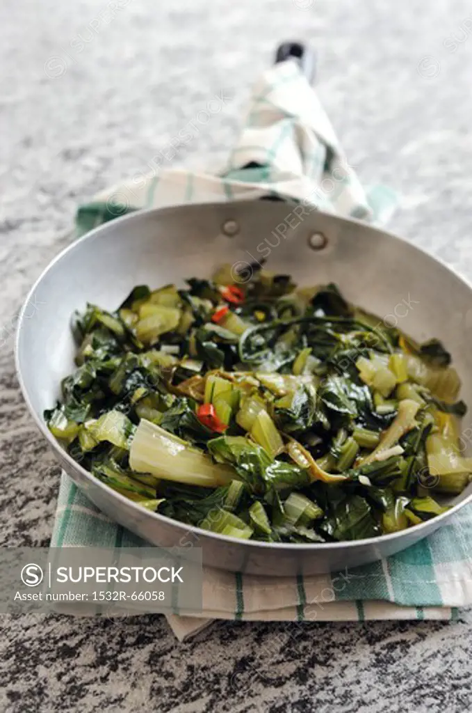 Fried chicory greens with chilli and garlic
