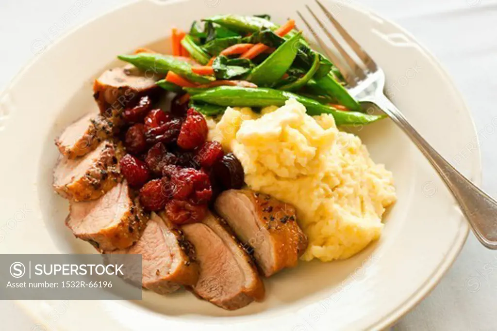 Sliced Duck Breast with Cherries, Mashed Potato and Mixed Vegetables