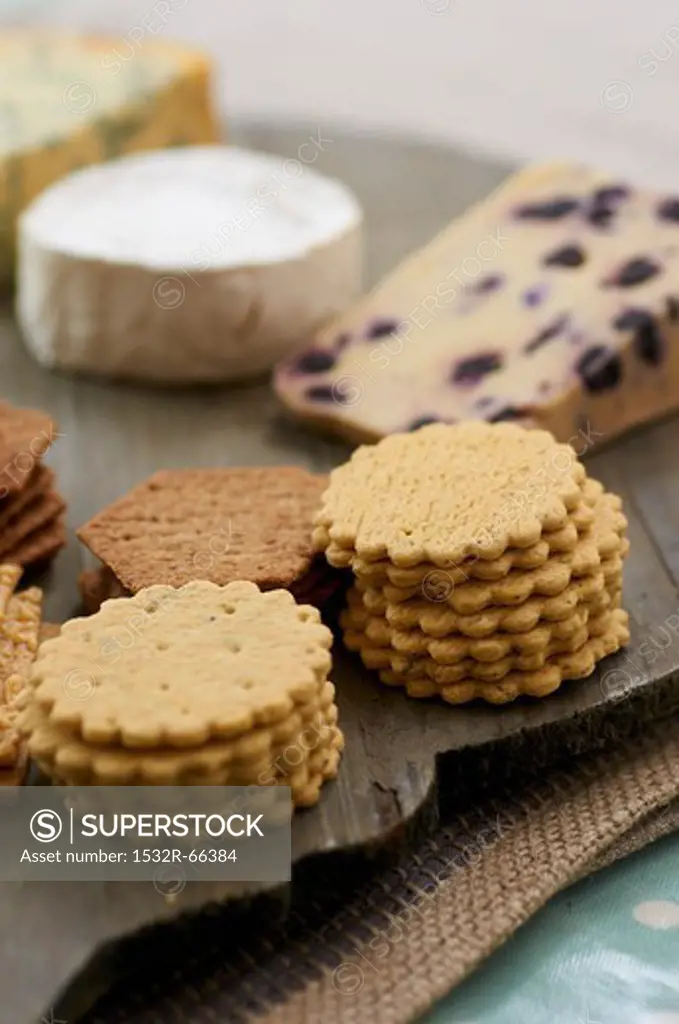 A cheese platter with various crackers