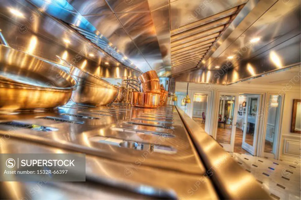 Copper pots in a stainless steel kitchen