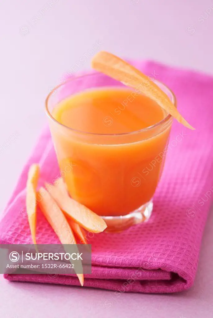 A glass of carrot and apple juice