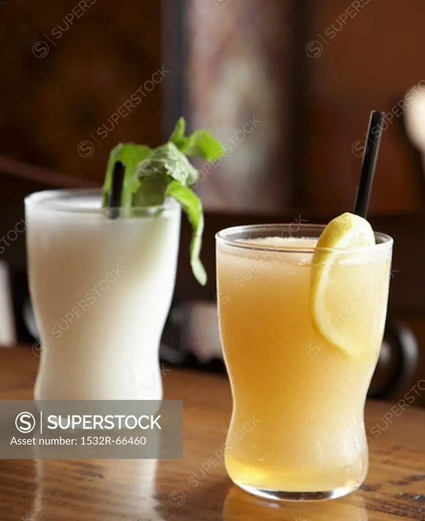 Spanish Slushito” Drinks;White One is Coconut Rum Lemongrass Lime; Orange One is Grapefruit Bourbon Chamomile