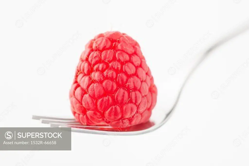 A raspberry on a fork