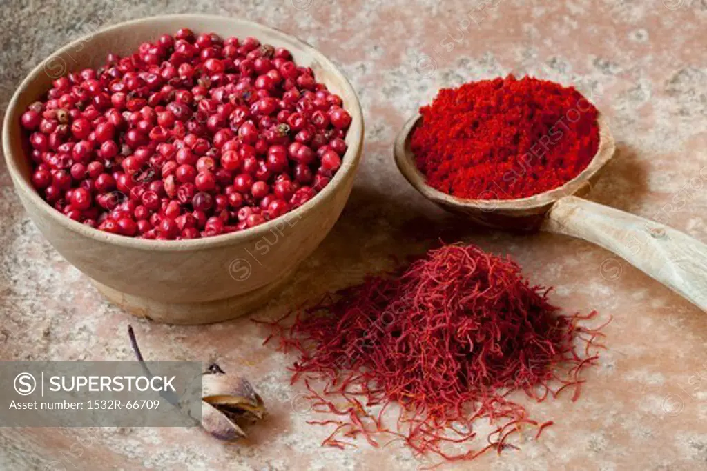 Red peppercorns, saffron threads and paprika