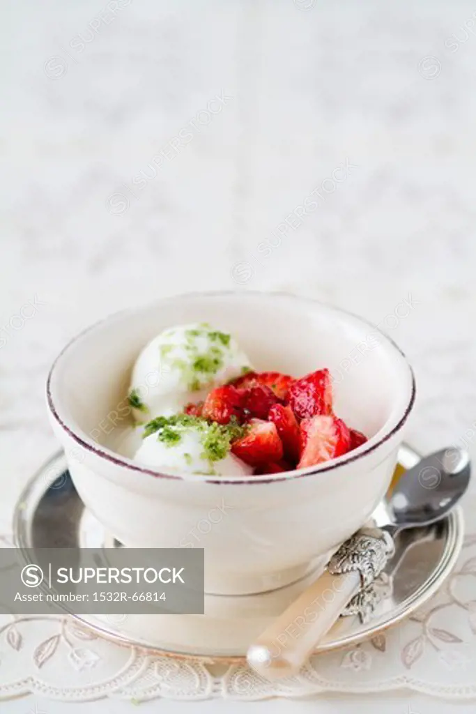 Frozen yoghurt with strawberry salad and basil sugar