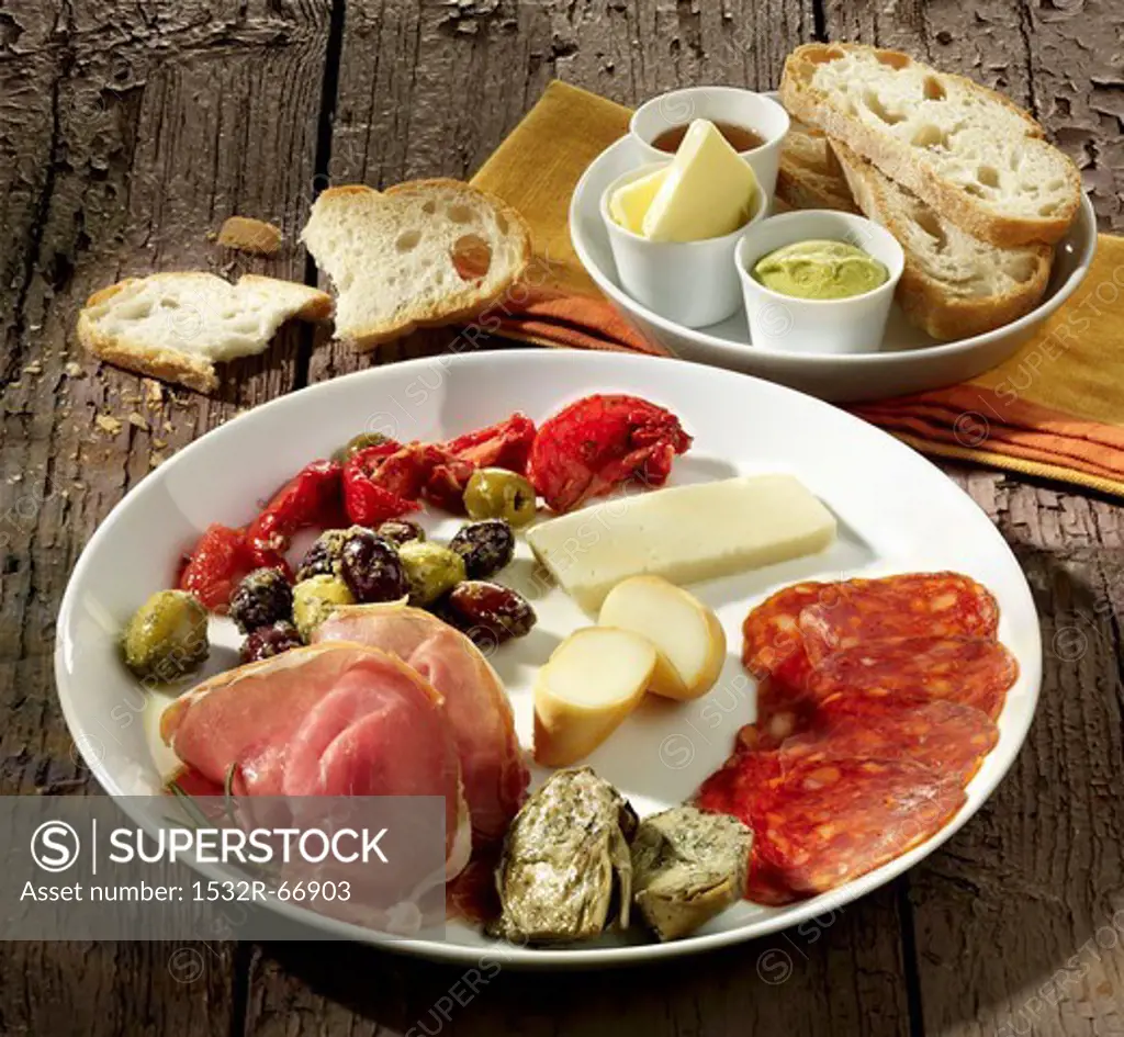 A plate of Mediterranean cheeses and cold meats